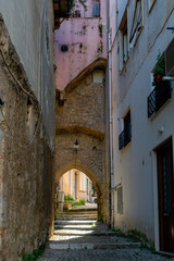 Walking in historical town Gaeta, summer vacation destination on Tyrrhenien sea with sandy beaches and old houses