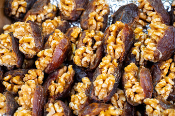 Turkish or arabic sweet dessert, ripe dried dadels with walnuts sweetened with syrup or honey.