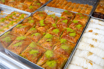 Turkish or arabic sweet dessert, baklava made from filo pastry, filled with chopped nuts and sweetened with syrup or honey.