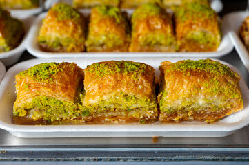 Turkish or arabic sweet dessert, baklava made from filo pastry, filled with chopped pistachio nuts and sweetened with syrup or honey.