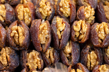 Turkish or arabic sweet dessert, ripe dried dadels with walnuts sweetened with syrup or honey.