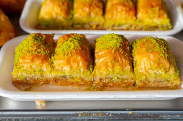 Turkish or arabic sweet dessert, baklava made from filo pastry, filled with chopped pistachio nuts and sweetened with syrup or honey.