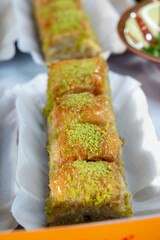Turkish or arabic sweet dessert, baklava made from filo pastry, filled with chopped pistachio nuts and sweetened with syrup or honey.