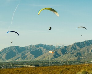 Paragliders flying near the Point of the Mountain in Salt Lake City, Utah, United States