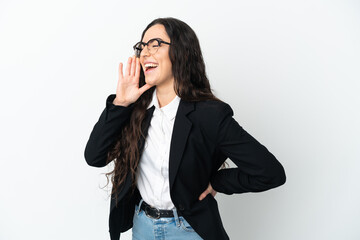 Young business woman isolated on white background shouting with mouth wide open to the side