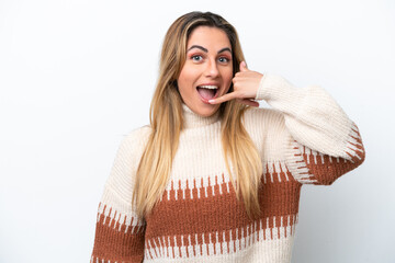 Young caucasian woman isolated on white background making phone gesture. Call me back sign