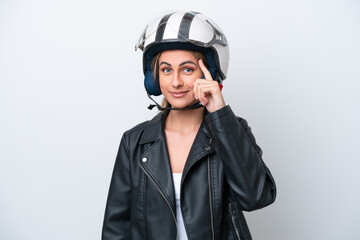Young caucasian woman with a motorcycle helmet isolated on white background thinking an idea