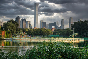 Fototapeta premium Cloudy sky and dark clouds in Beijing International Trade CBD building complex