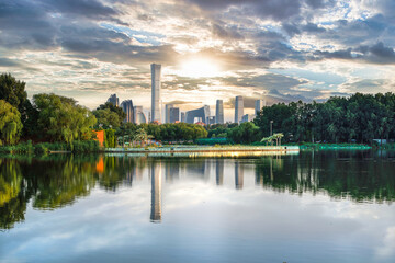 Dark clouds reflected on the water surface of Beijing International Trade CBD building complex