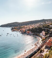 Vertical shot of the city Villefranche-sur-Mer by the sea