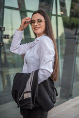 Business woman of the 21st century. A young girl works in the park. Flexible working hours.  Modern young girl.