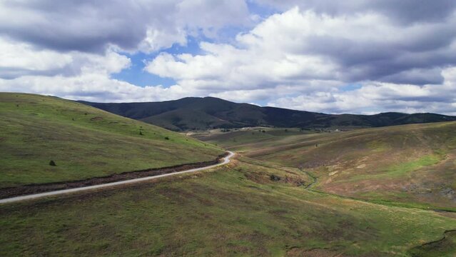 Empty road through beautiful Zlatibor region landscape. Aerial view from drone
