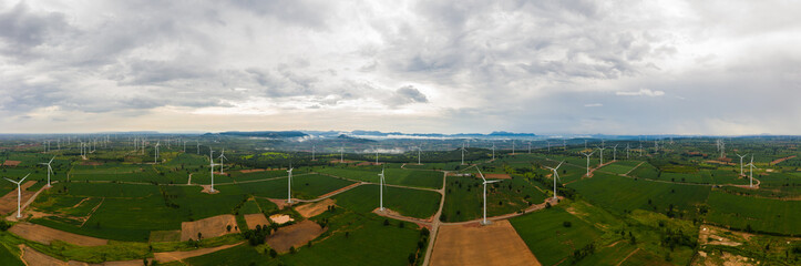 Panorama aerial view wind turbine in agricultural field for generate electrical power. Wind energy turbines one of the cleanest, renewable electric energy source. wind power and alternative energy.