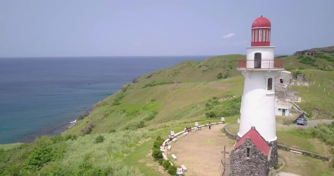 Drone footage of the Basco Lighthouse on the shore in Batanes, Philippines