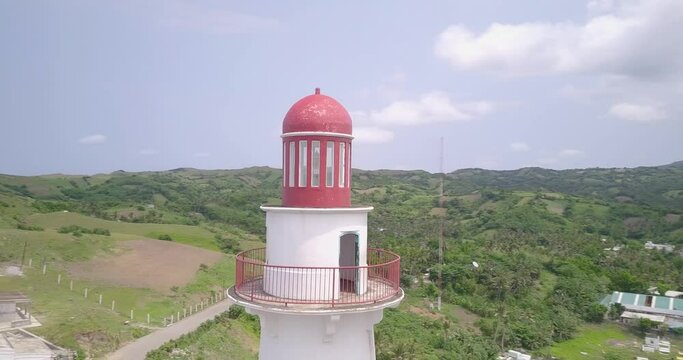 Drone footage of the Basco Lighthouse on the shore in Batanes, Philippines