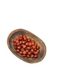 Corylus avellana - Hazelnut nuts in the wooden bowl