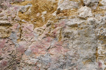 Wall painting of fingers and hands on the cliff. Ancient wall paintings on limestone cliffs. Archaeological site of color paintings of Pratu Pha Camp of Lampang, Thailand.