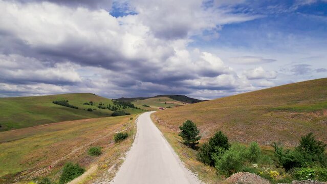 Empty road through beautiful Zlatibor region landscape. Aerial view from drone