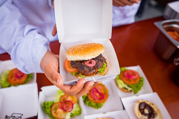 Hamburgers presented and packed in a box