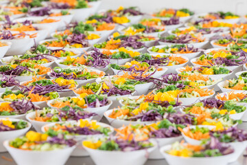 Table full of colorful Poke-bowls