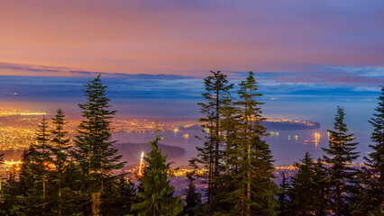Cityscape Night. Evening illumination in Vancouver, Canada. Aerial view.