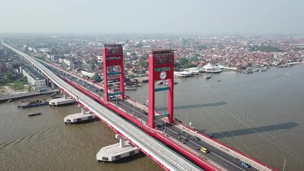 Aerial view of Ampera bridge in Indonesia with traffic during the daytime