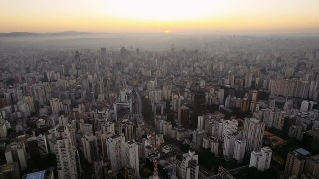 Aerial view of the city of Sao Paulo, Brazil at sunset. Cinematic 4K