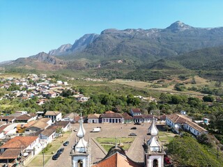 Aerial shot of Church of Our Lady of Conception (Catas Altas) in Brazil with landscape and town view