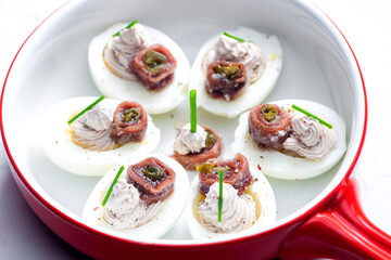eggs filled with anchoa spread with anchoa on the top