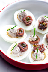 eggs filled with anchoa spread with anchoa on the top