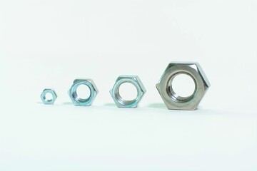 Closeup of hex nuts on a white background
