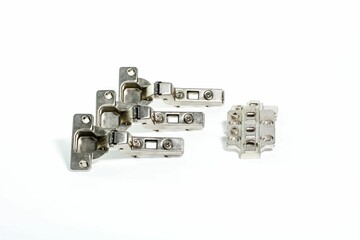 Closeup of metallic hinge systems isolated on white background