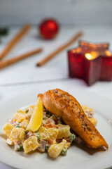 Traditional Christmas dinner in Czech Republic - salmon fillet with potato salad