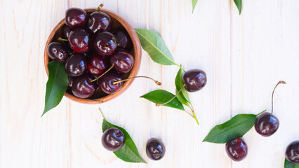 A plate of ripe cherries on the table