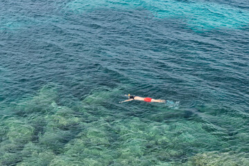 Man swimming with snorkelling gear