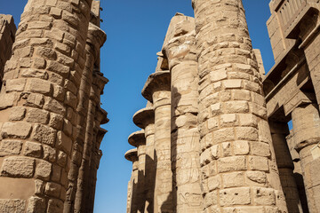 Different hieroglyphs on the walls and columns in the Karnak temple. Karnak temple is the largest...
