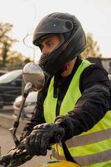 Заголовок	
Motorcyclist in a driving lesson. Lessons in auto and motorcycle school. A student in a special uniform drives a motorcycle. Summer training on a moped. Student and teacher.	
