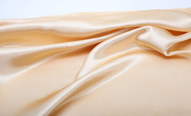 Beige nacre wave fabric silk. Abstract texture horizontal copy space background.