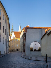 Prague Castle in the spring morning sun. Narrow streets, stairs and wonderful palaces in Prague Castle. A unique sight without a crowd of tourists on a wonderful spring morning. Prague Castle has been