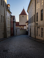 Prague Castle in the spring morning sun. Narrow streets, stairs and wonderful palaces in Prague Castle. A unique sight without a crowd of tourists on a wonderful spring morning. Prague Castle has been