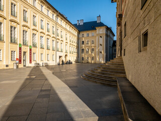 Fototapeta na wymiar Prague Castle in the spring morning sun. Narrow streets, stairs and wonderful palaces in Prague Castle. A unique sight without a crowd of tourists on a wonderful spring morning. Prague Castle has been