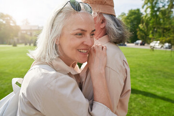 Fototapeta premium Happy mature woman caressing her grey-haired partner