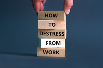 Destress from work symbol. Concept words How to destress from work on wooden blocks. Doctor hand. Beautiful grey background. Psychological business and destress from work concept. Copy space.