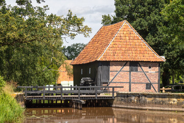 Fototapeta na wymiar Corn water mill - Oldemeule; from the year 1690, on the Oelerbeek in the hamlet of Oele in the Dutch municipality of Hengelo.
