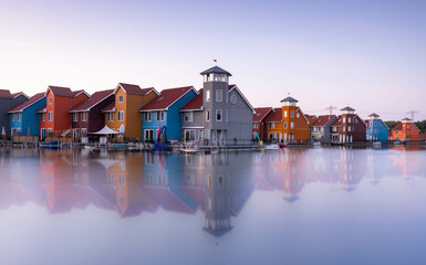 Famous Dutch cityscape, Reitdiephaven street with traditional colorful houses on water, Groningen, Netherlands, Europe