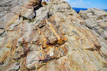 Atlantic ocean waves and rock beach along coastline in Portland, Maine, USA