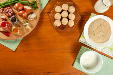 Conception of preparing brazilian snacks chiken croquette (coxinha de frango) - Top view
