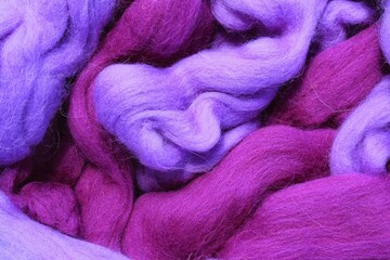 Close-up of colourful merino wool purple and violet striped background. Abstract handmade craft...