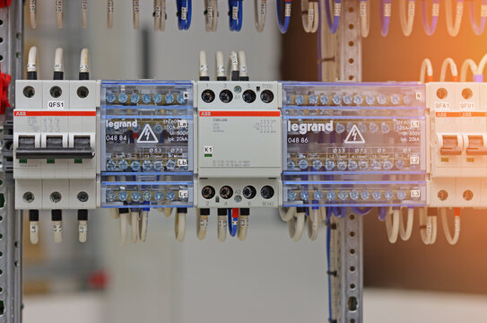 ABB current circuit breakers and voltage distribution busbars in the electrical panel.Sunflare.