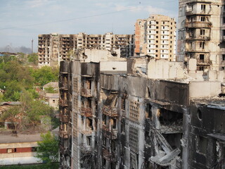 War in Ukraine. The ruins of residential buildings burned down and destroyed by Russian troops in Mariupol.